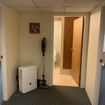 Hall between bedrooms in front of bathroom